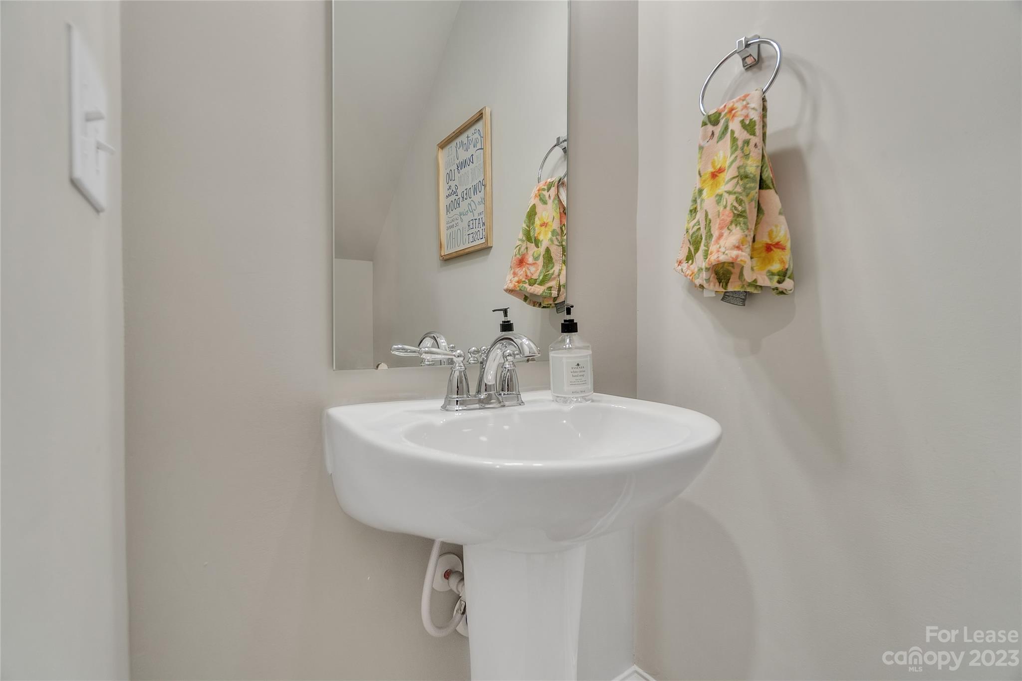 12840 Statesville Road, Unit 15B Huntersville, NC 28078 - Photo 17 of 37 a bathroom with a sink a mirror and vanity