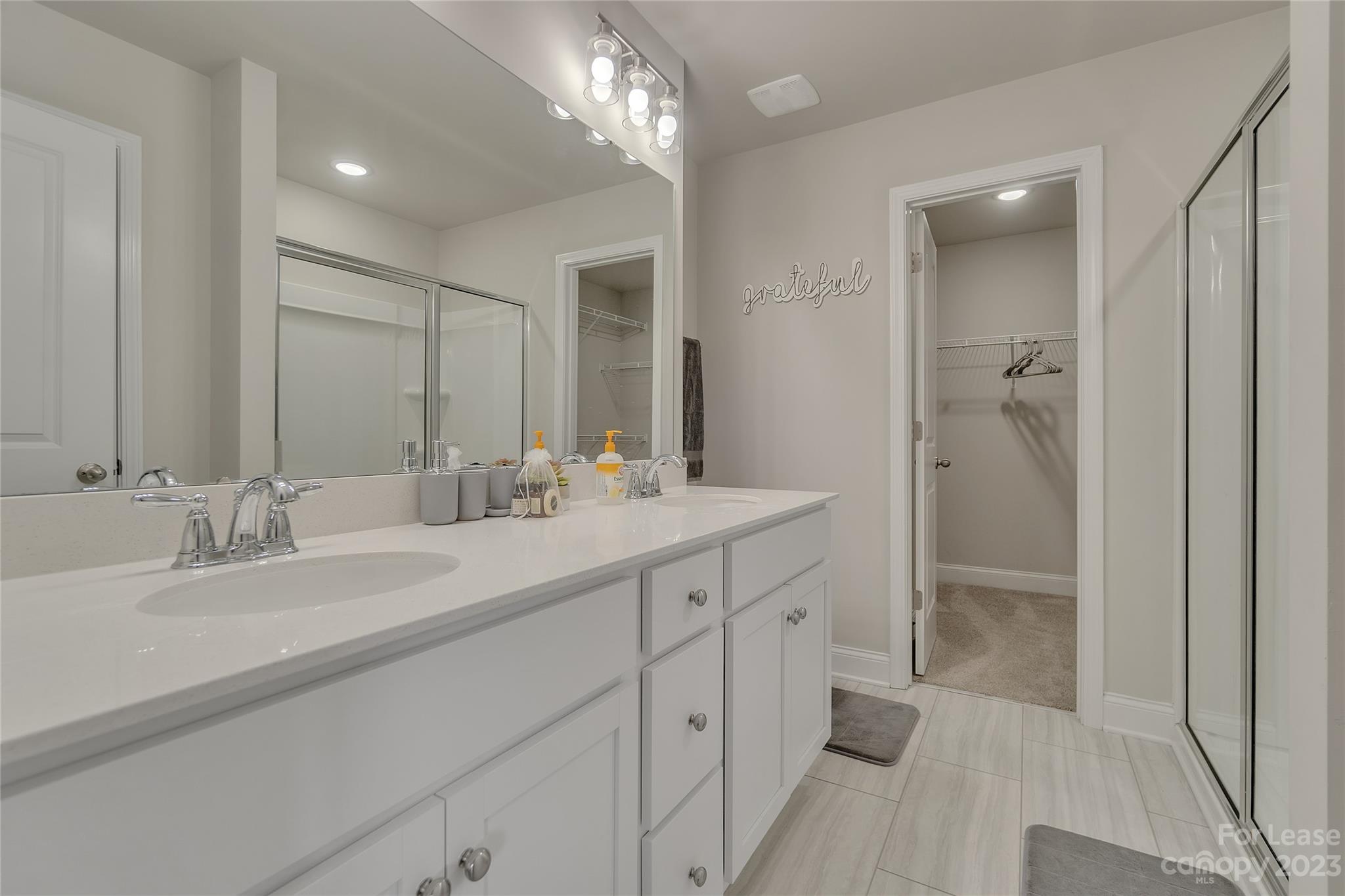 12840 Statesville Road, Unit 15B Huntersville, NC 28078 - Photo 20 of 37 a bathroom with double vanity sinks and a mirror