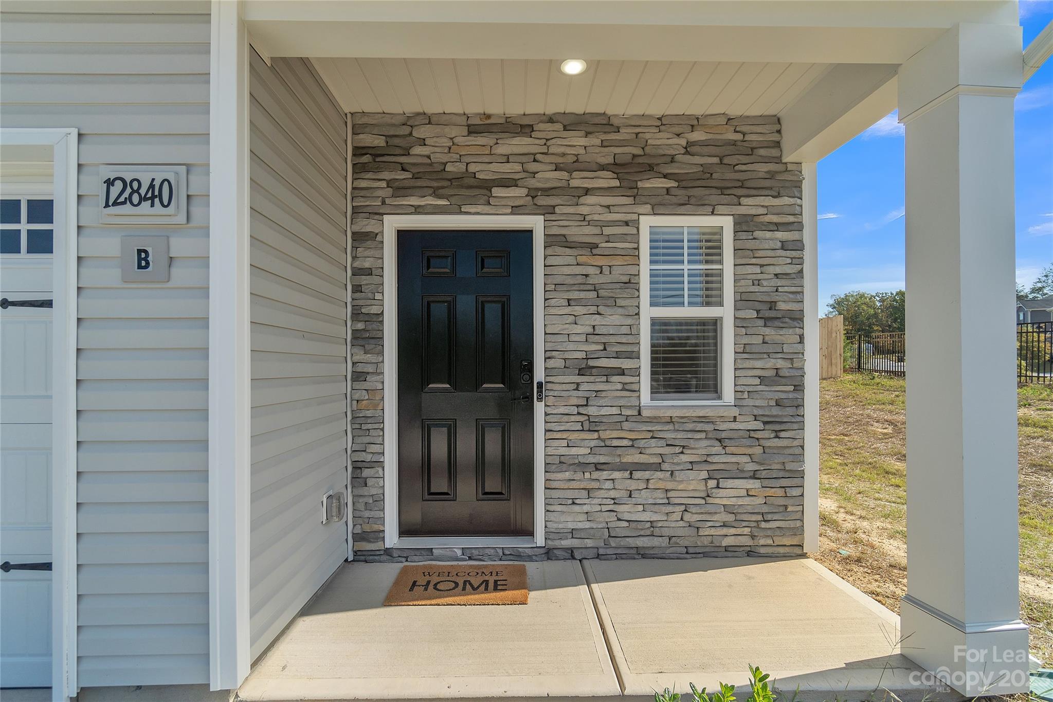 12840 Statesville Road, Unit 15B Huntersville, NC 28078 - Photo 2 of 37 a view of a brick house with a large window