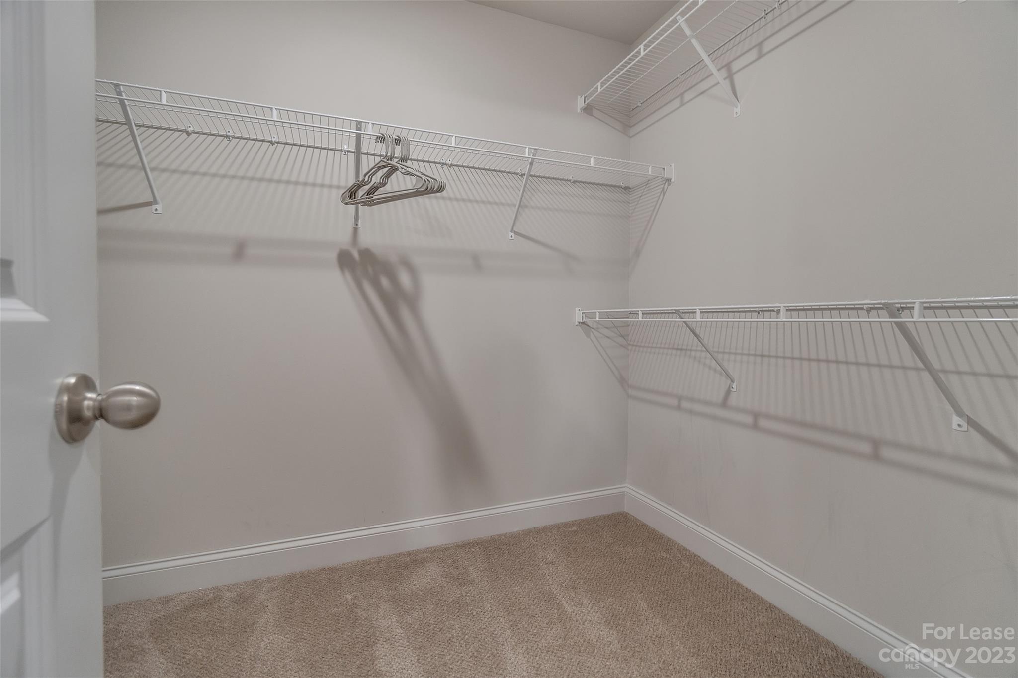 12840 Statesville Road, Unit 15B Huntersville, NC 28078 - Photo 21 of 37 a view of a room with racks on the wall