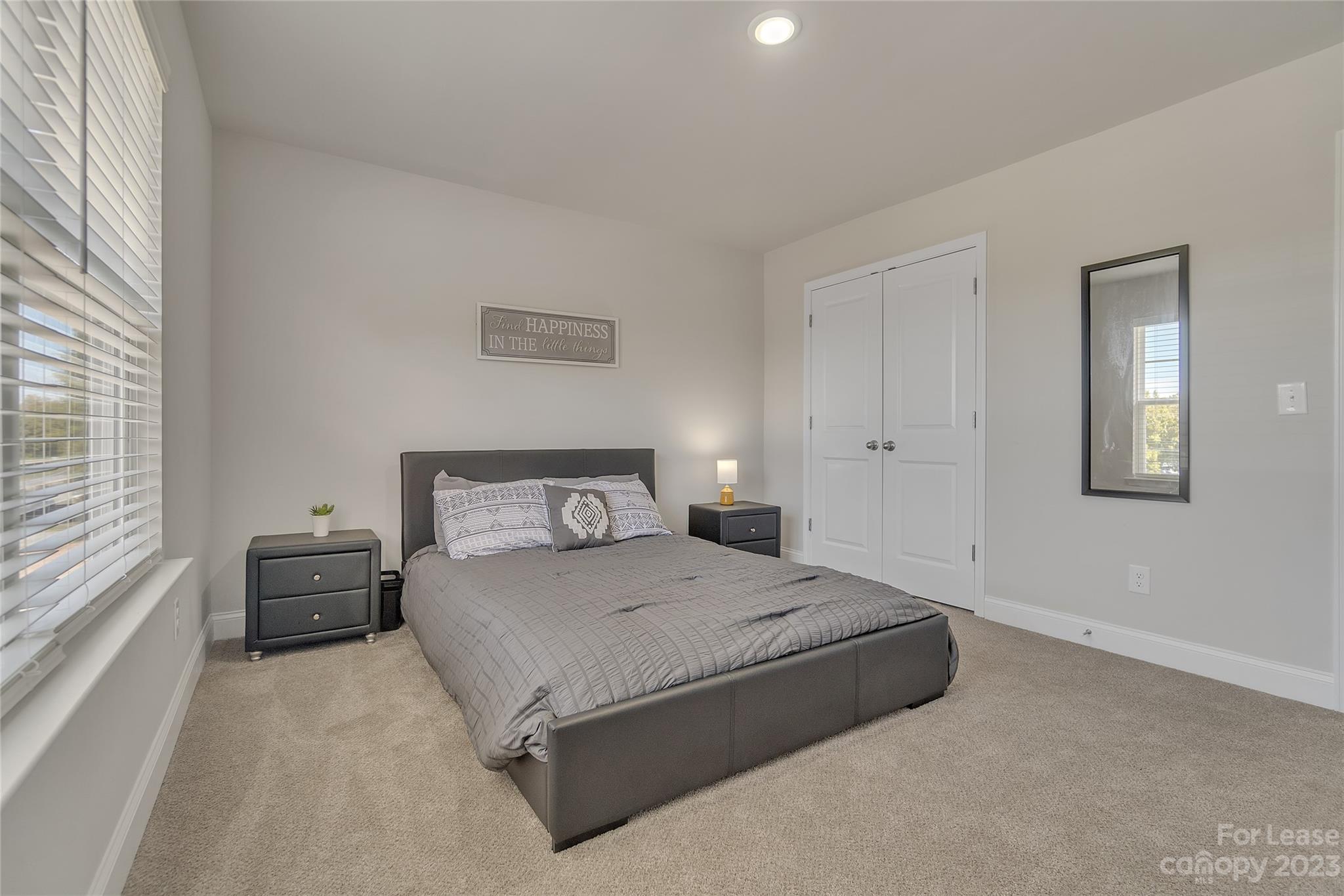 12840 Statesville Road, Unit 15B Huntersville, NC 28078 - Photo 27 of 37 a bedroom with a bed and a large window