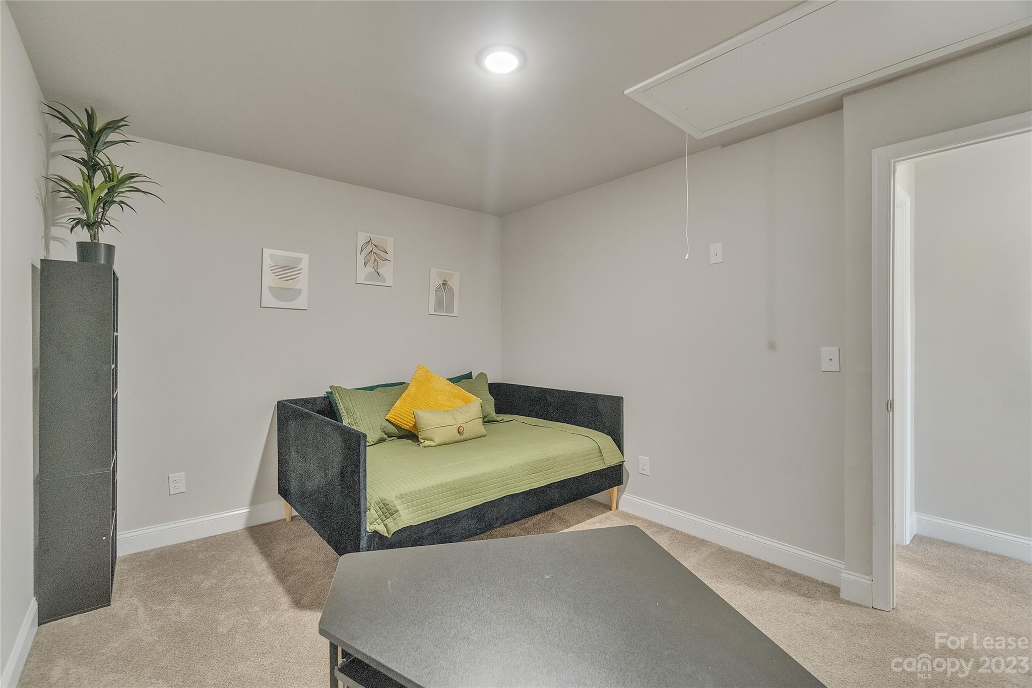 12840 Statesville Road, Unit 15B Huntersville, NC 28078 - Photo 31 of 37 a living room with furniture and a potted plant