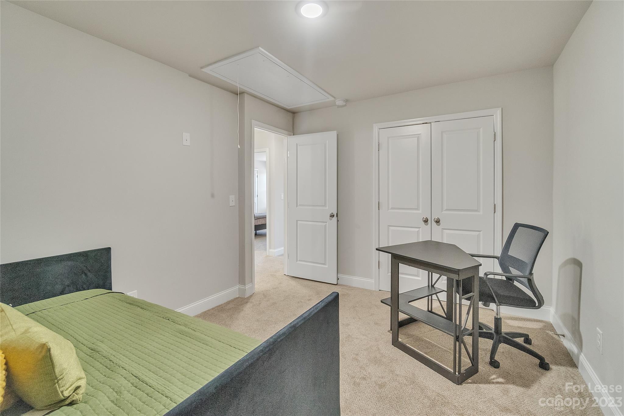 12840 Statesville Road, Unit 15B Huntersville, NC 28078 - Photo 32 of 37 a bedroom with a bed and chair