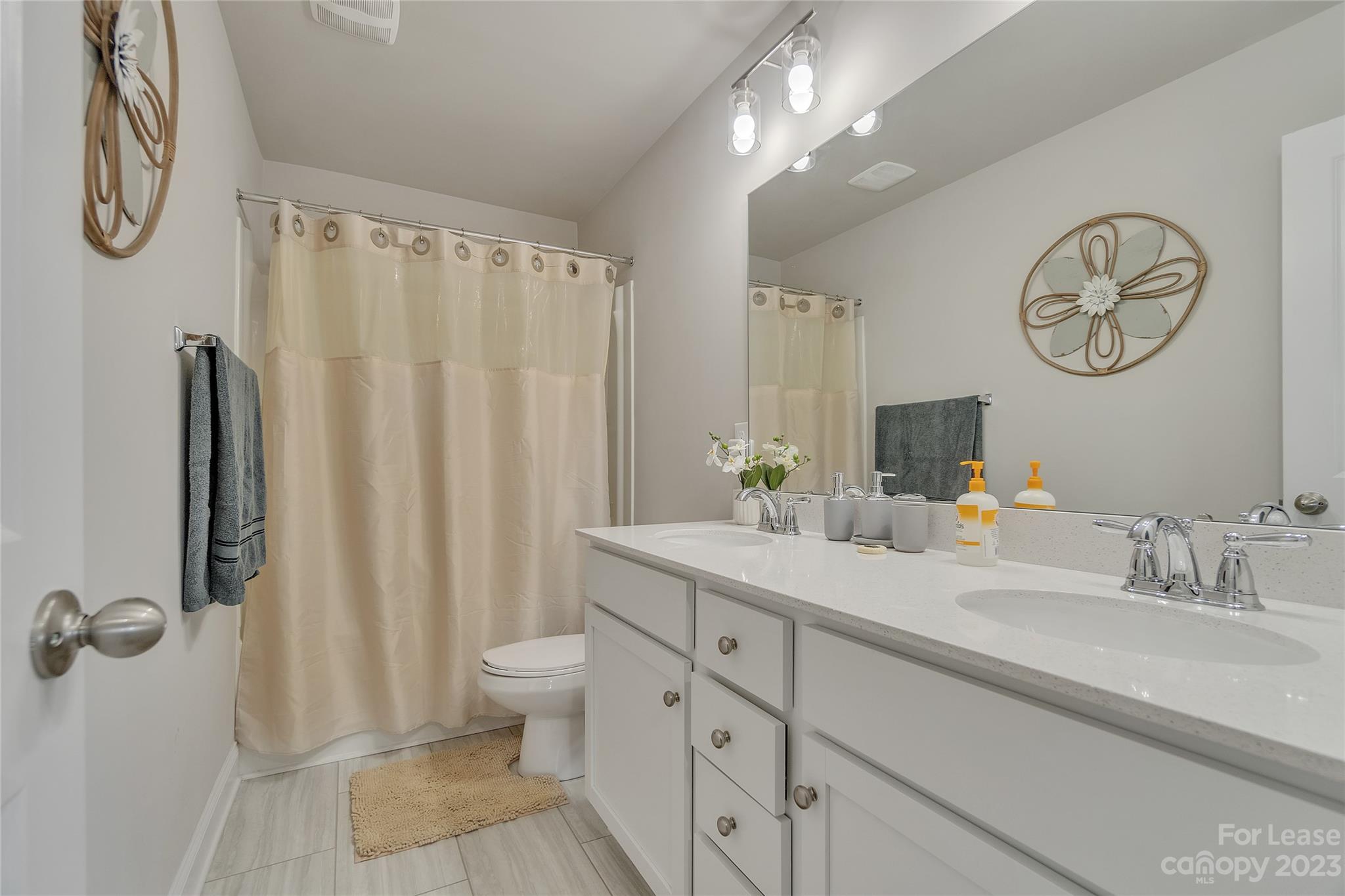 12840 Statesville Road, Unit 15B Huntersville, NC 28078 - Photo 33 of 37 a bathroom with a double vanity sink and a mirror