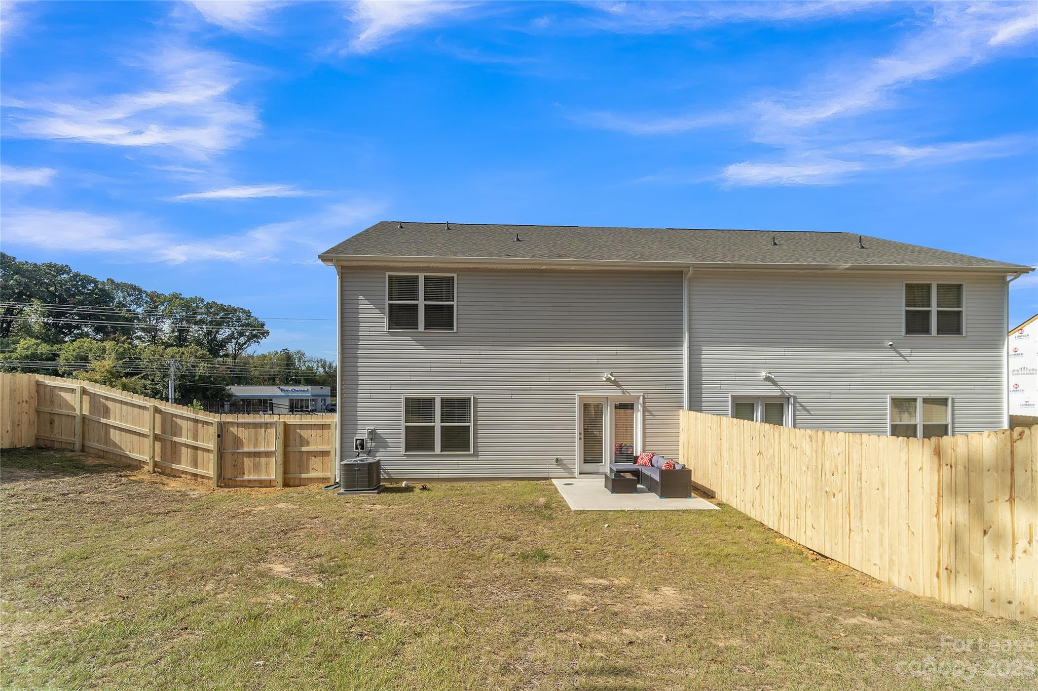 12840 Statesville Road, Unit 15B Huntersville, NC 28078 - Photo 36 of 37 a front view of a house with a yard