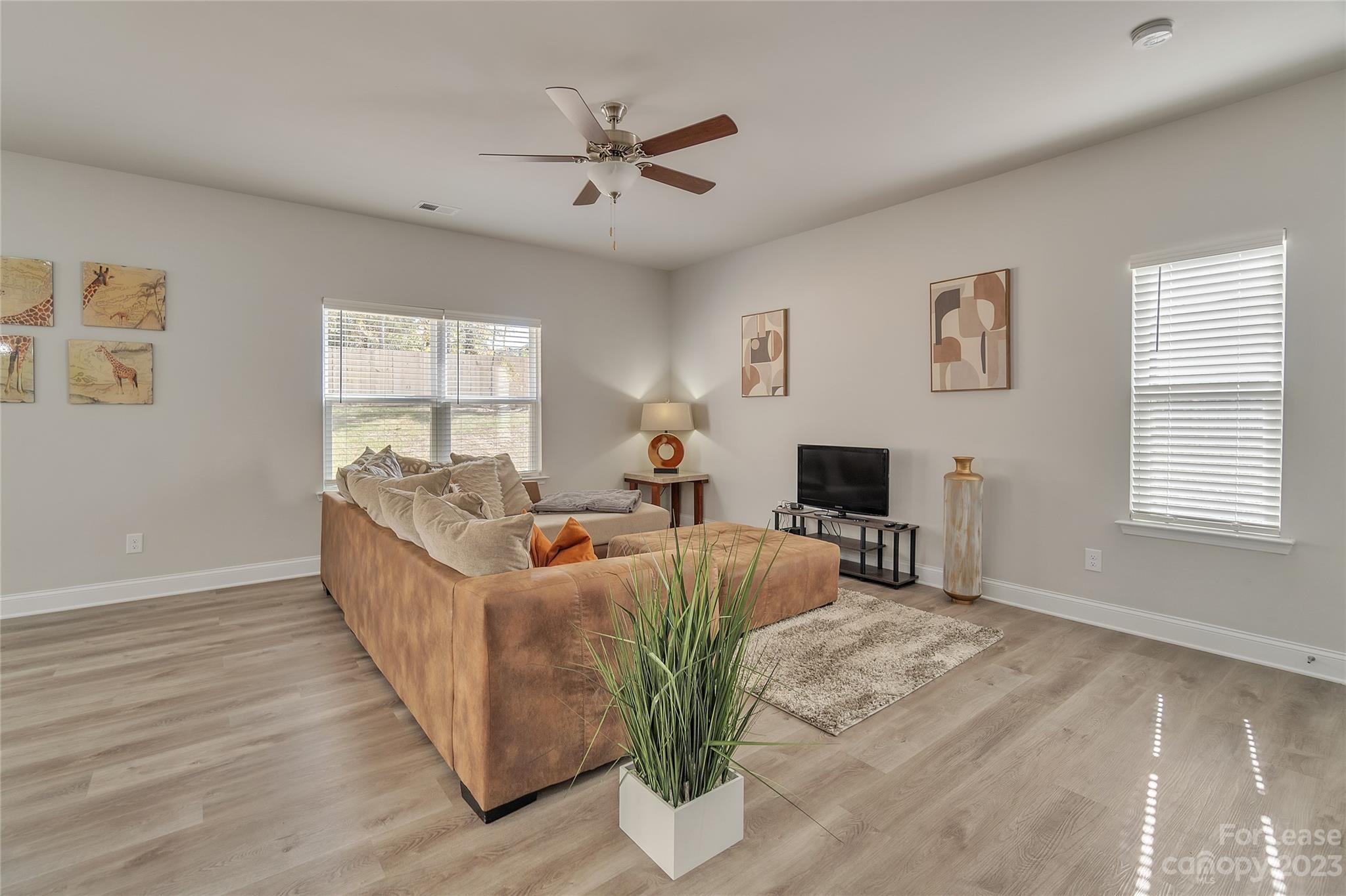 12840 Statesville Road, Unit 15B Huntersville, NC 28078 - Photo 5 of 37 a living room with furniture and a wooden floor
