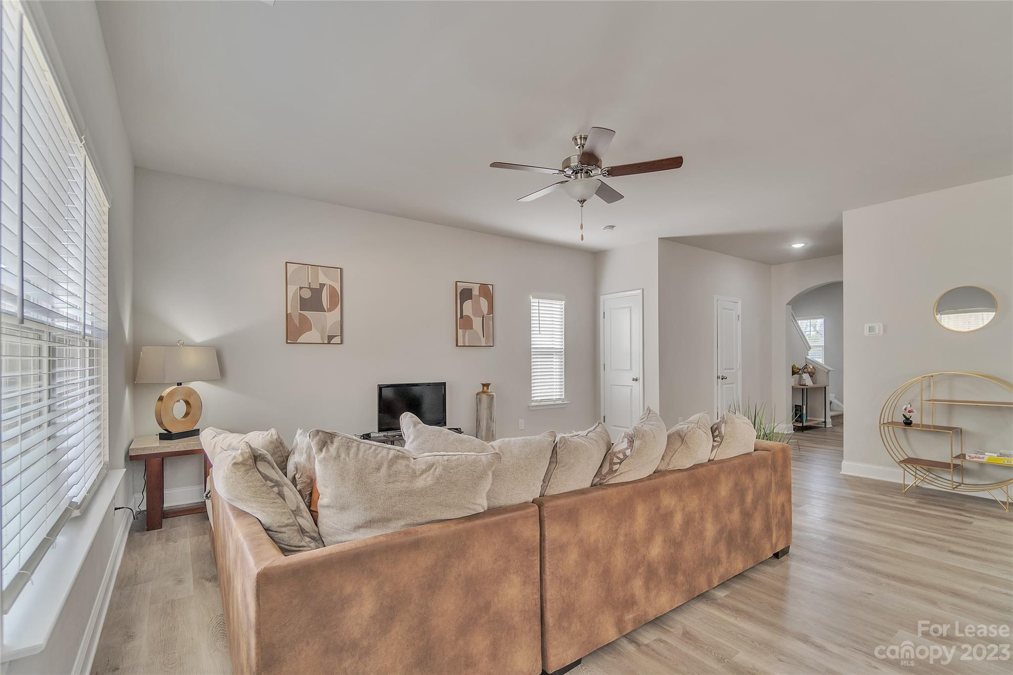 12840 Statesville Road, Unit 15B Huntersville, NC 28078 - Photo 6 of 37 a living room with furniture and a wooden floor