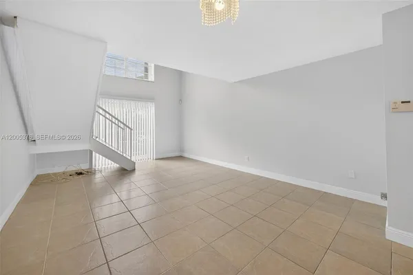 a view of an empty room and entryway