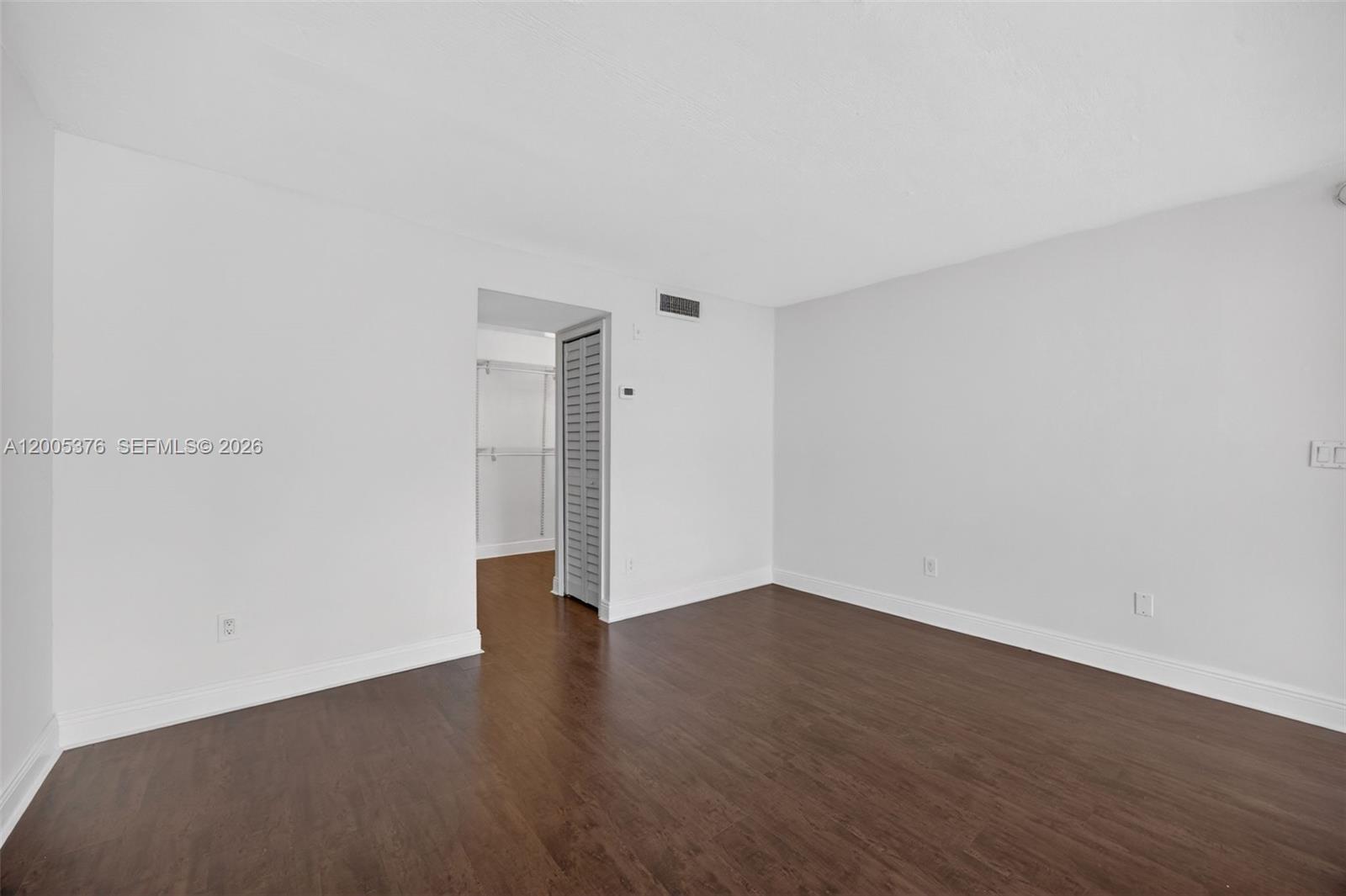 8550 Southwest 109th Avenue, Unit 5217 Miami, FL 33173 - Photo 16 of 34 a view of an empty room with wooden floor
