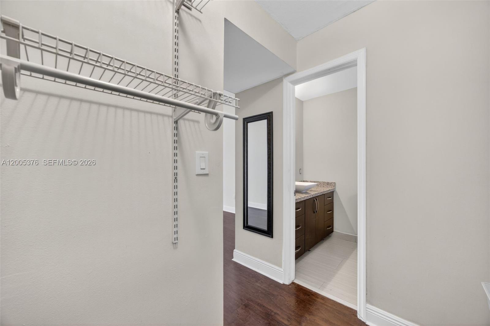 8550 Southwest 109th Avenue, Unit 5217 Miami, FL 33173 - Photo 21 of 34 a bathroom with a sink a toilet and shower