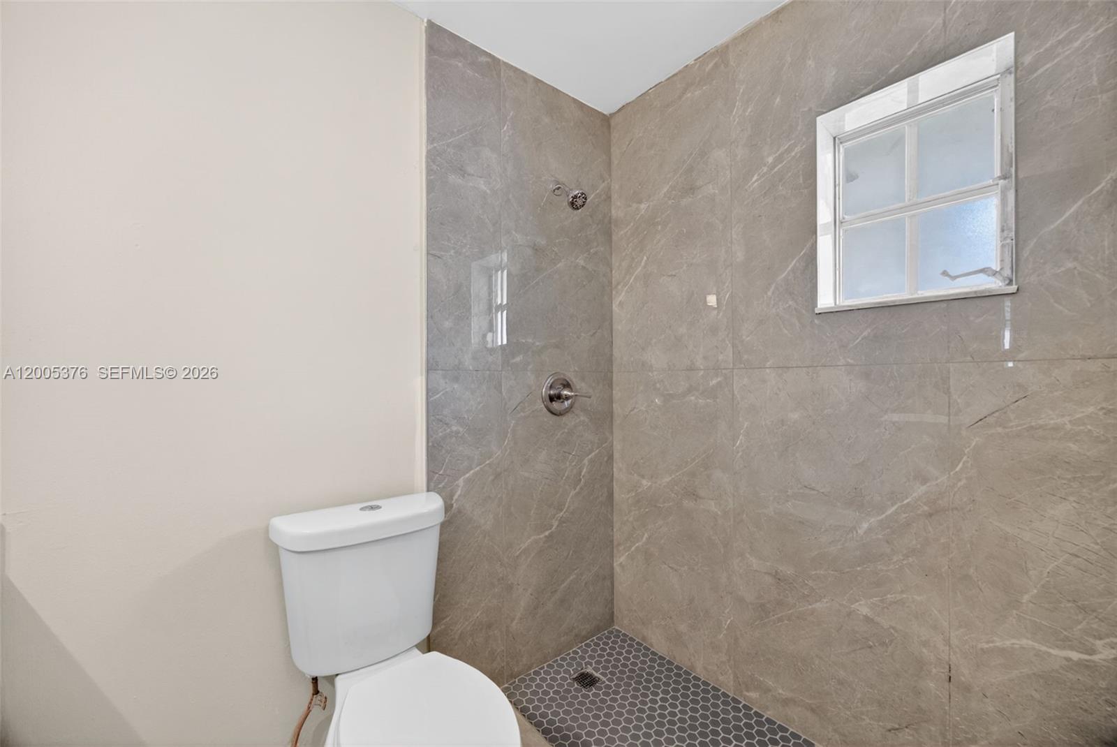 8550 Southwest 109th Avenue, Unit 5217 Miami, FL 33173 - Photo 24 of 34 a white toilet sitting next to a shower