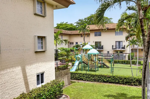 a view of a house with swimming pool and sitting area