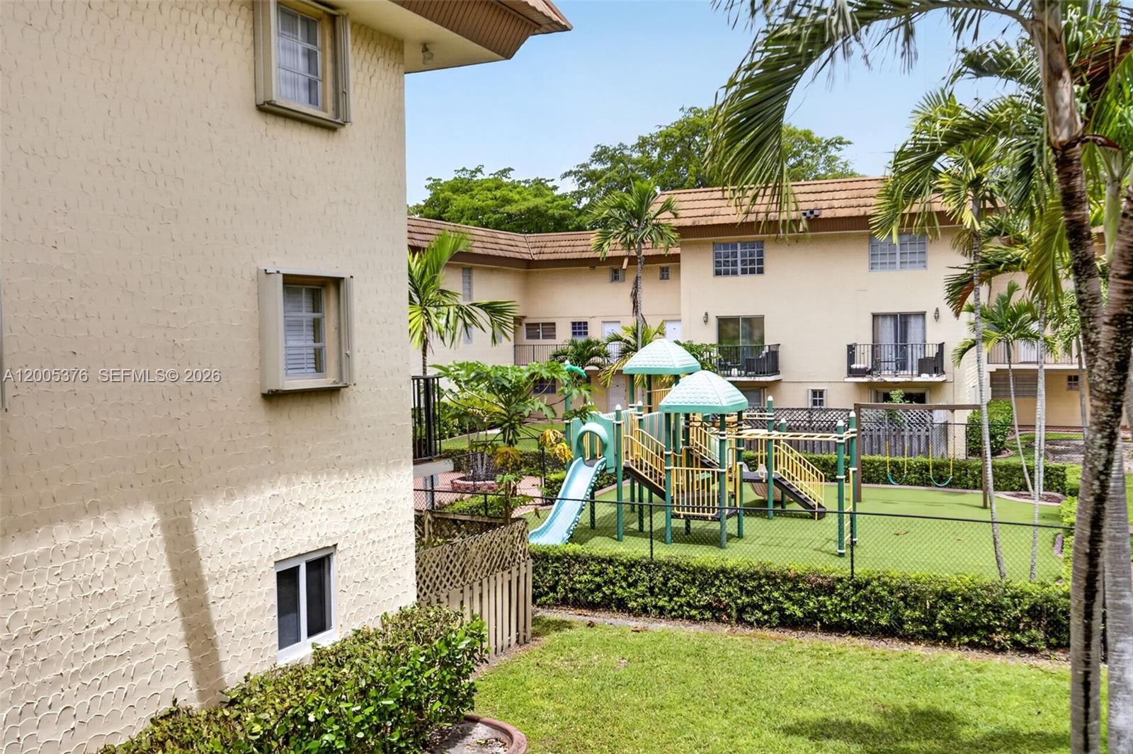 8550 Southwest 109th Avenue, Unit 5217 Miami, FL 33173 - Photo 31 of 34 a front view of a house with a yard table and chairs