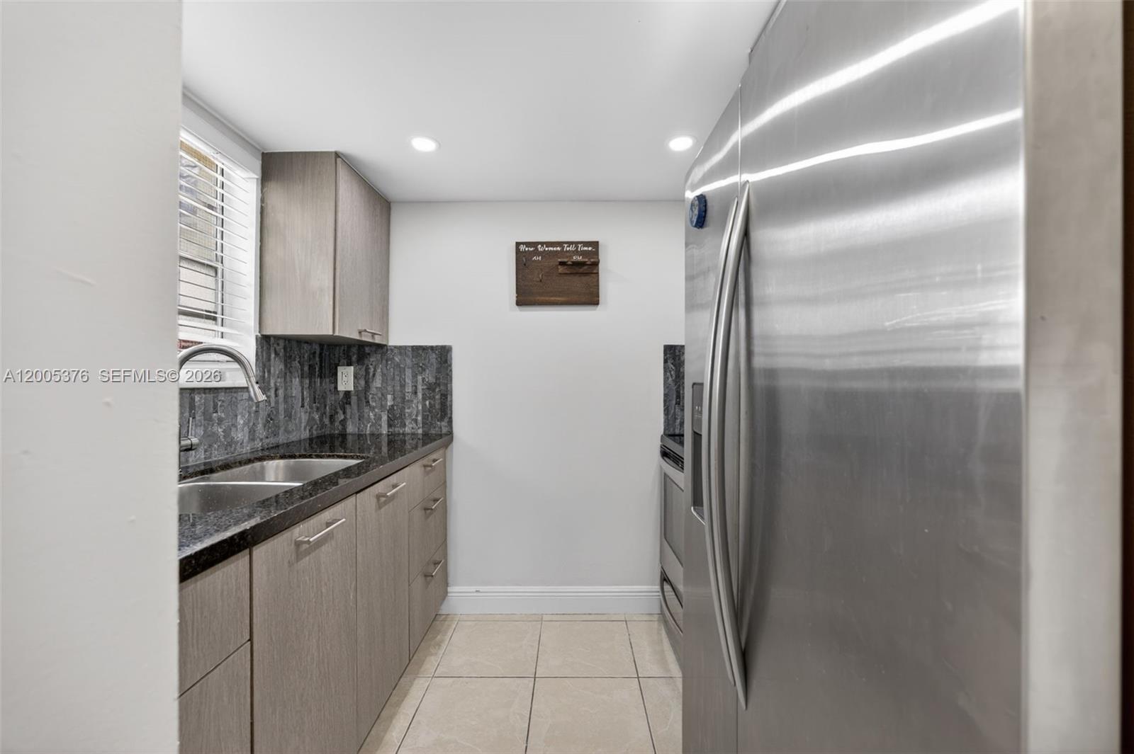 8550 Southwest 109th Avenue, Unit 5217 Miami, FL 33173 - Photo 5 of 34 a kitchen with stainless steel appliances granite countertop a refrigerator and a sink