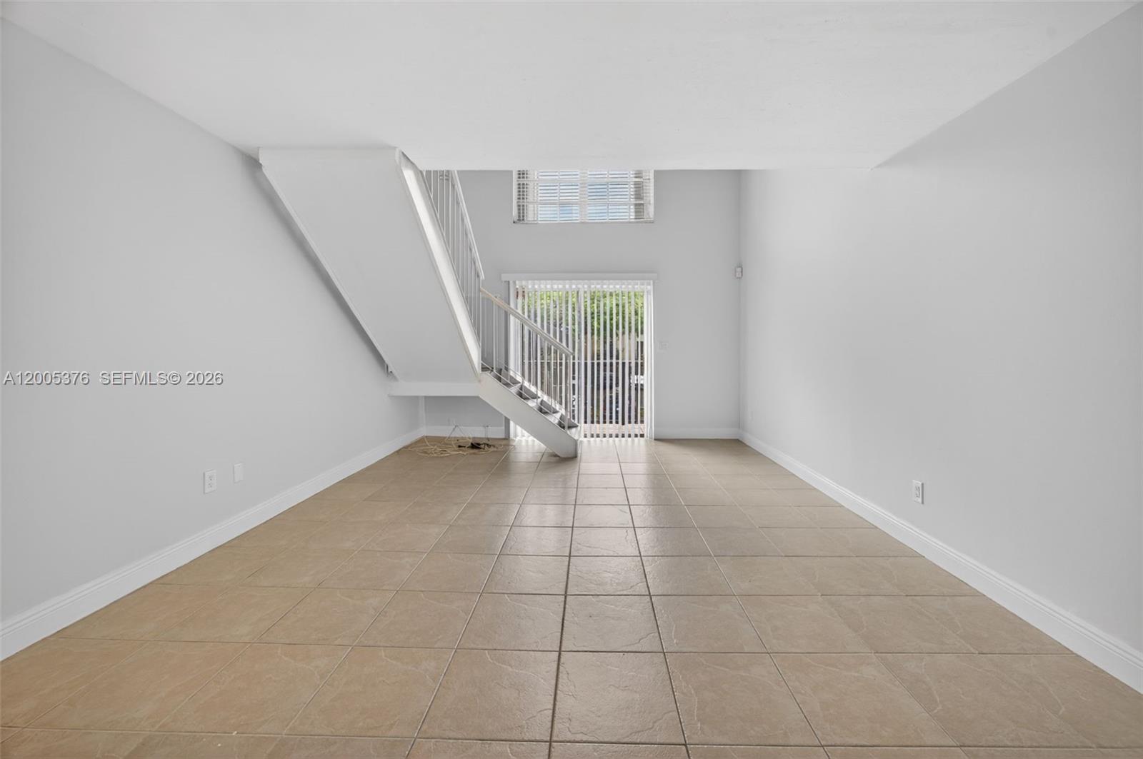 8550 Southwest 109th Avenue, Unit 5217 Miami, FL 33173 - Photo 10 of 34 a view of an empty room with a window