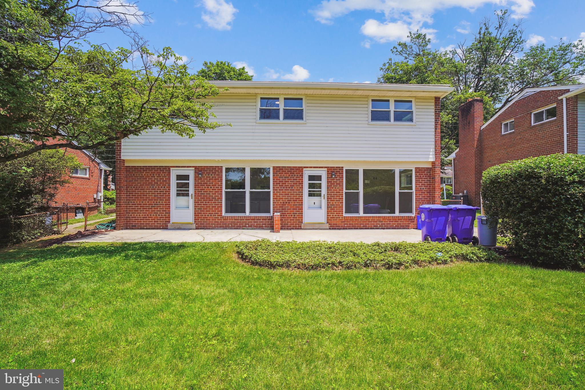 12924 Crisfield Road Silver Spring, MD 20906 - Photo 54 of 66 a view of a house with a backyard and a porch