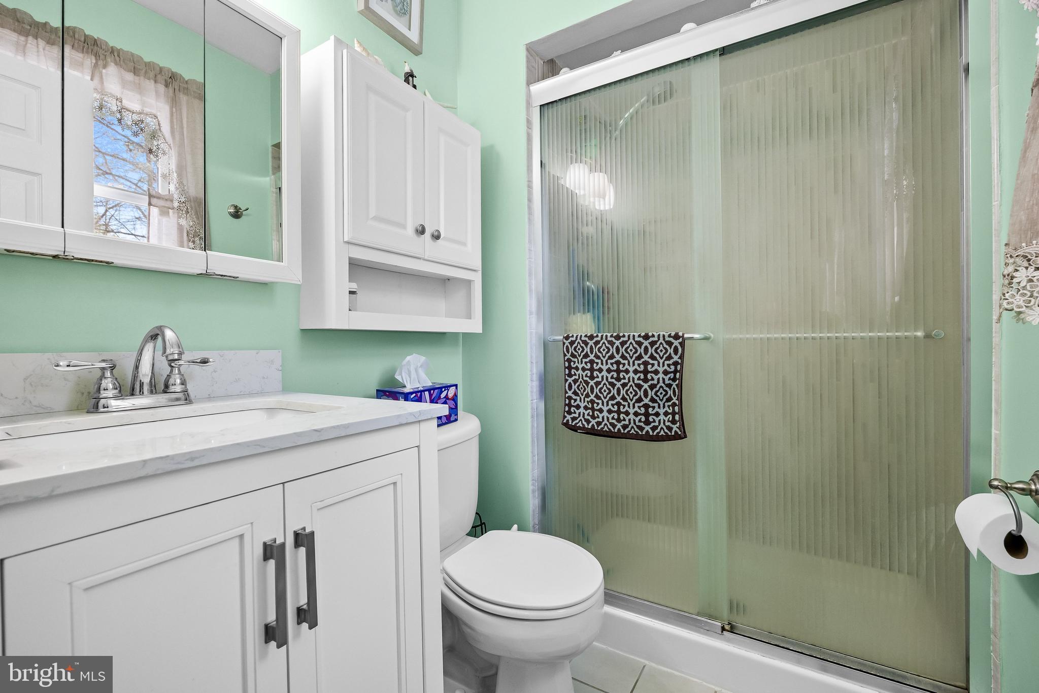 405 New Road Southampton, NJ 08088 - Photo 24 of 39 a bathroom with a sink a toilet and shower