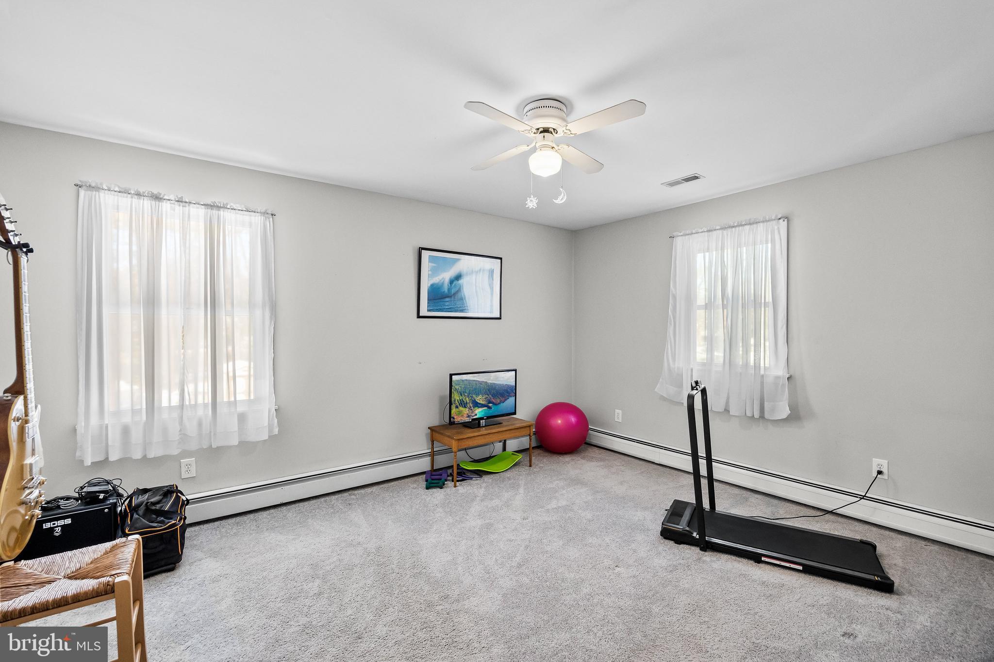 405 New Road Southampton, NJ 08088 - Photo 28 of 39 a room with gym equipment and a window