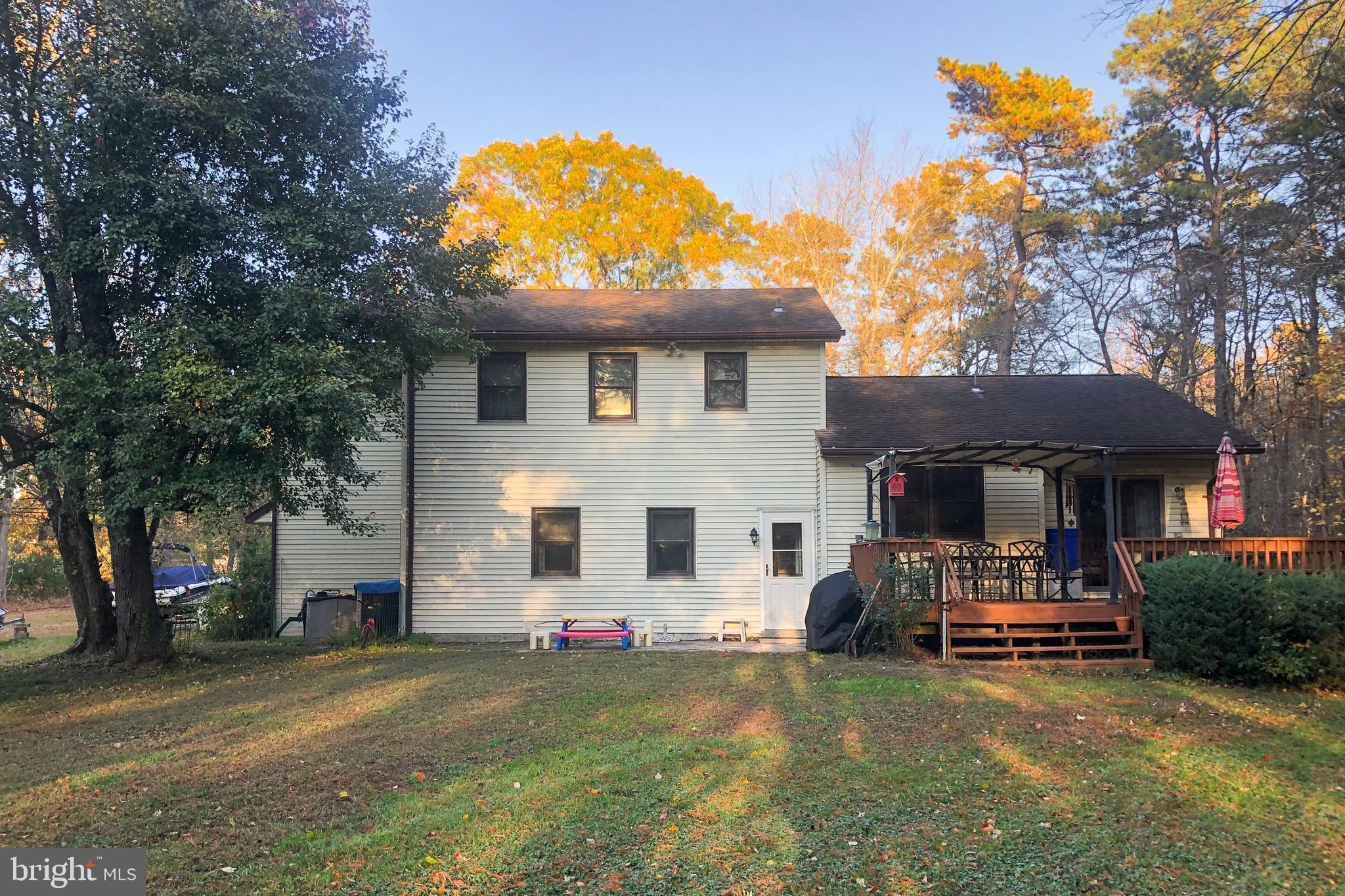 405 New Road Southampton, NJ 08088 - Photo 30 of 39 a view of a house with a backyard and a tree