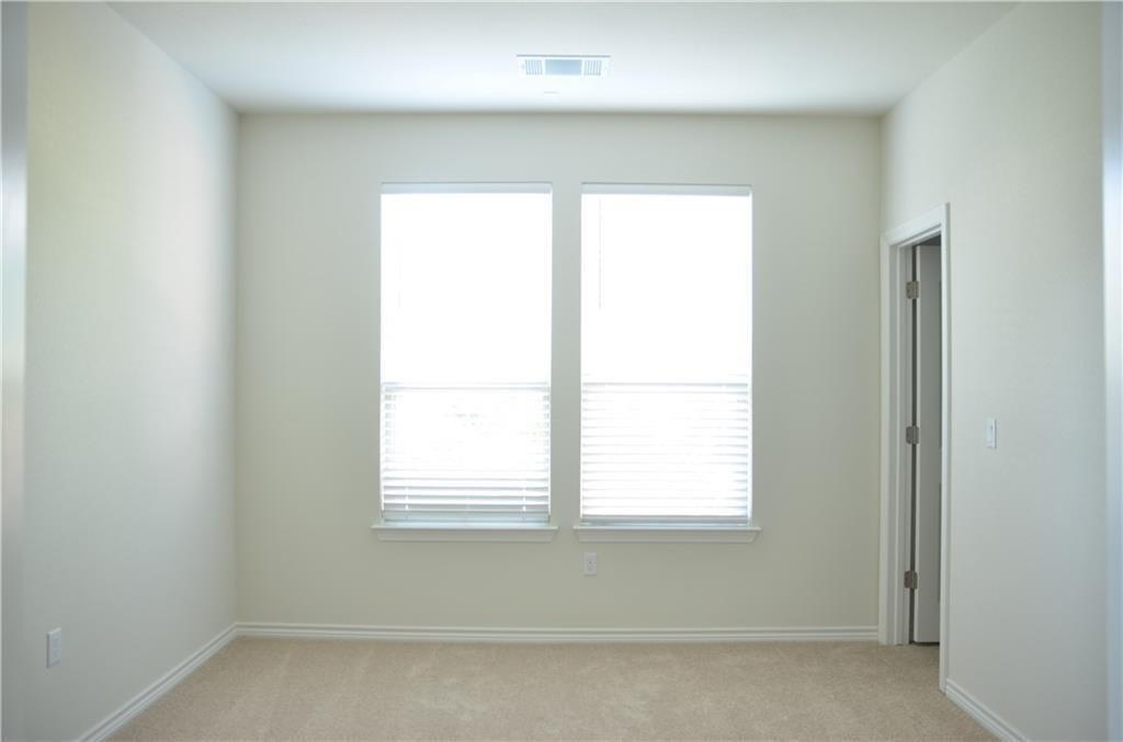 14403 McCoy Loop Austin, TX 78717 - Photo 12 of 29 Two luminous windows illuminate this inviting room, perfect for a cozy retreat or creative space.
