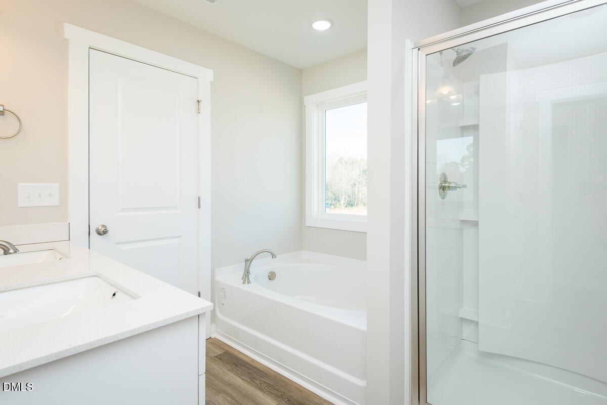 2823 Ricolden Trail Elon, NC 27244 - Photo 23 of 26 a bathroom with a bathtub and a sink