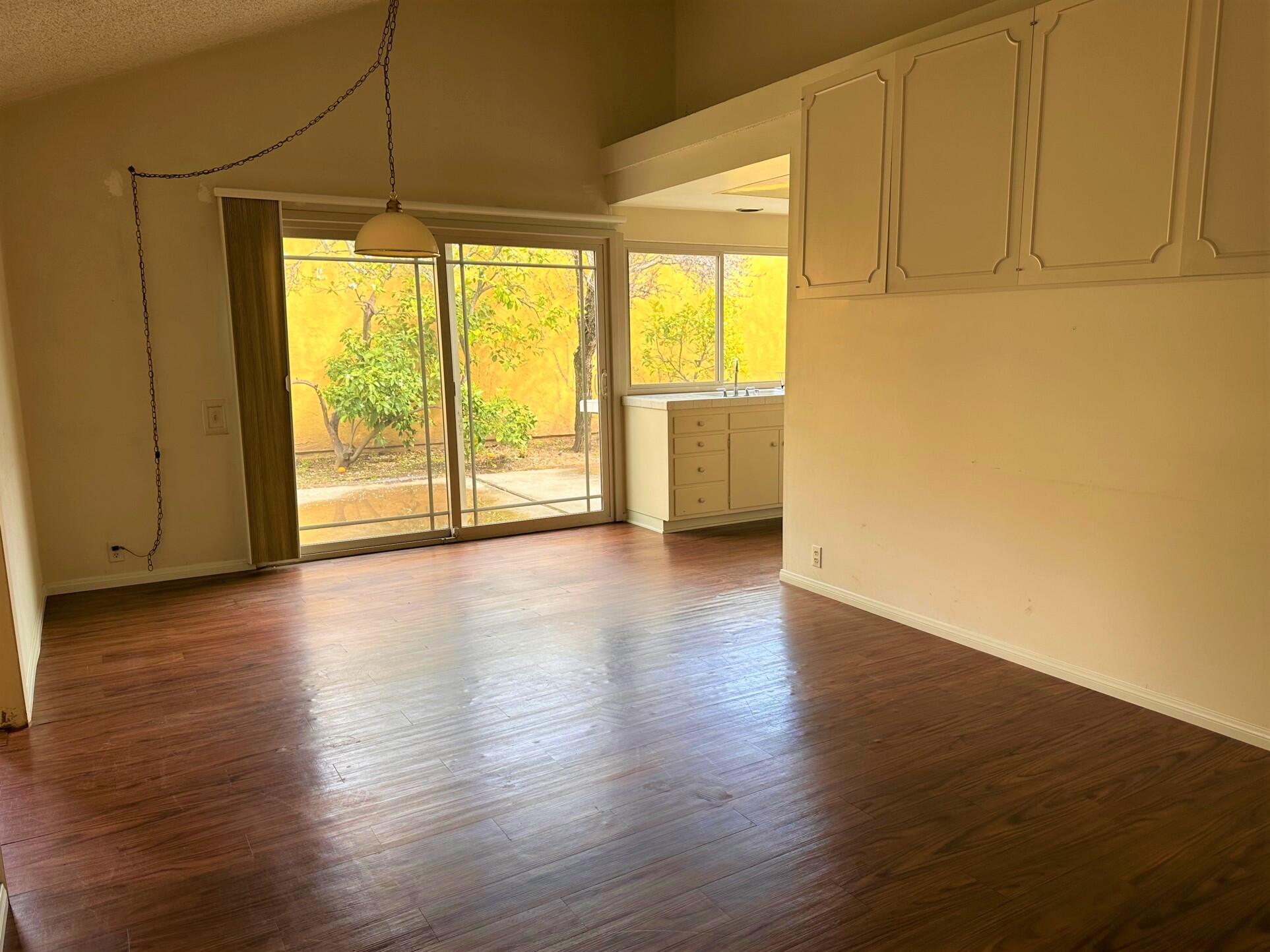 7248 Georgetown Road Goleta, CA 93117 - Photo 5 of 9 a view of empty room with wooden floor and fan