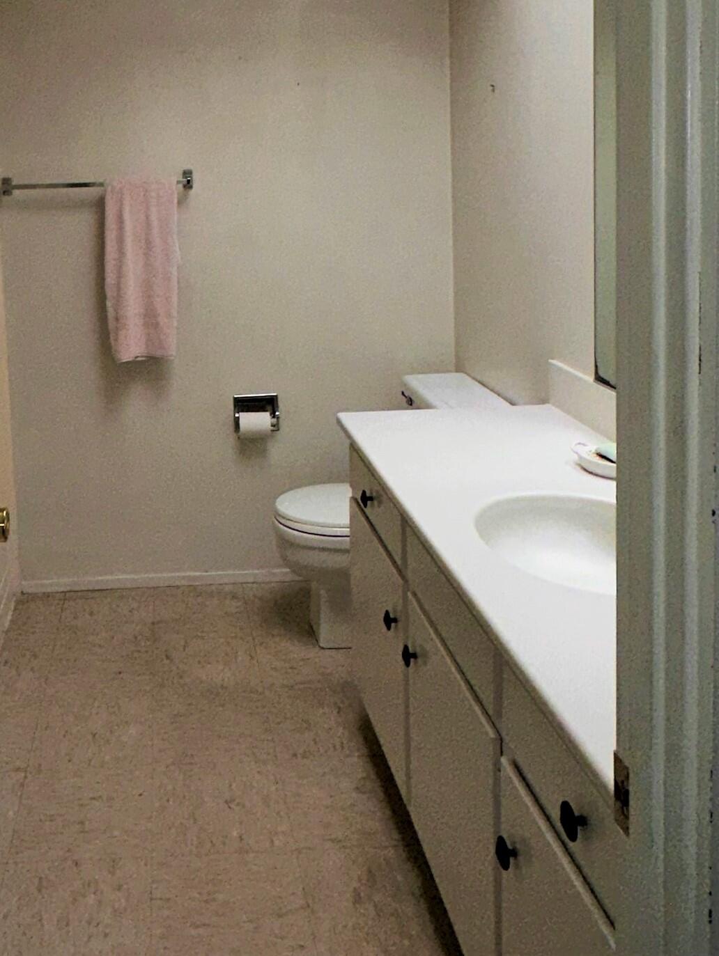 7248 Georgetown Road Goleta, CA 93117 - Photo 7 of 9 a bathroom with a sink a toilet and a shower