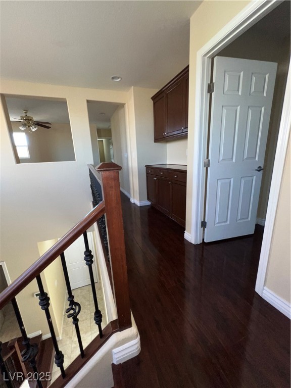 6592 Benvolio Court Las Vegas, NV 89141 - Photo 16 of 27 Corridor featuring an upstairs landing, dark wood-style flooring, and recessed lighting