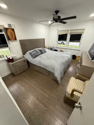 a bed room with a bed and a television