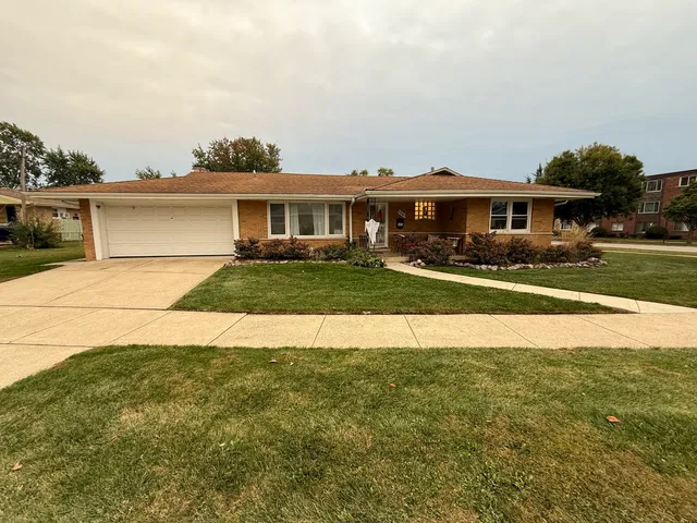 a view of house with outdoor space and sitting area