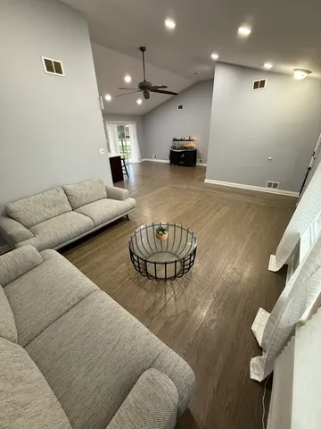 a living room with furniture and a table