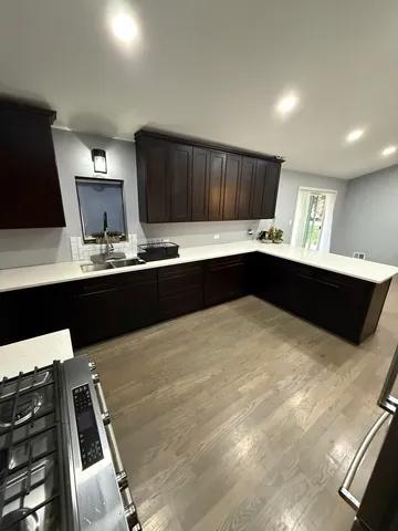 a kitchen with a sink and cabinets