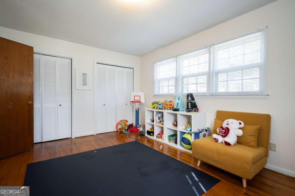 135 Tara Way Athens, GA 30606 - Photo 14 of 36 a room with furniture and a window