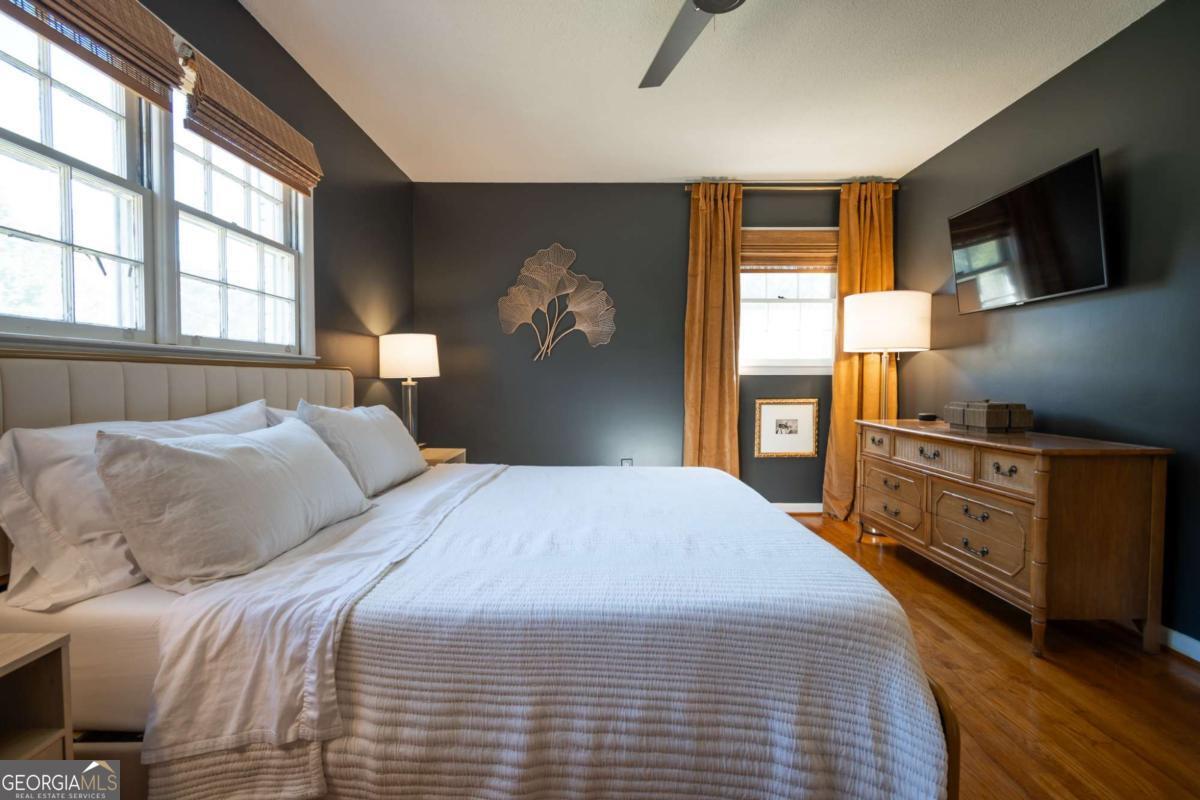 135 Tara Way Athens, GA 30606 - Photo 17 of 36 a bedroom with a bed and a flat screen tv