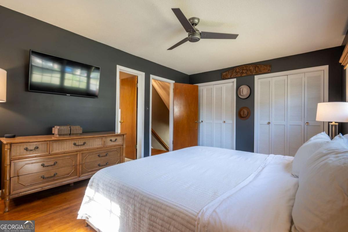 135 Tara Way Athens, GA 30606 - Photo 18 of 36 a bedroom with a bed and a dresser