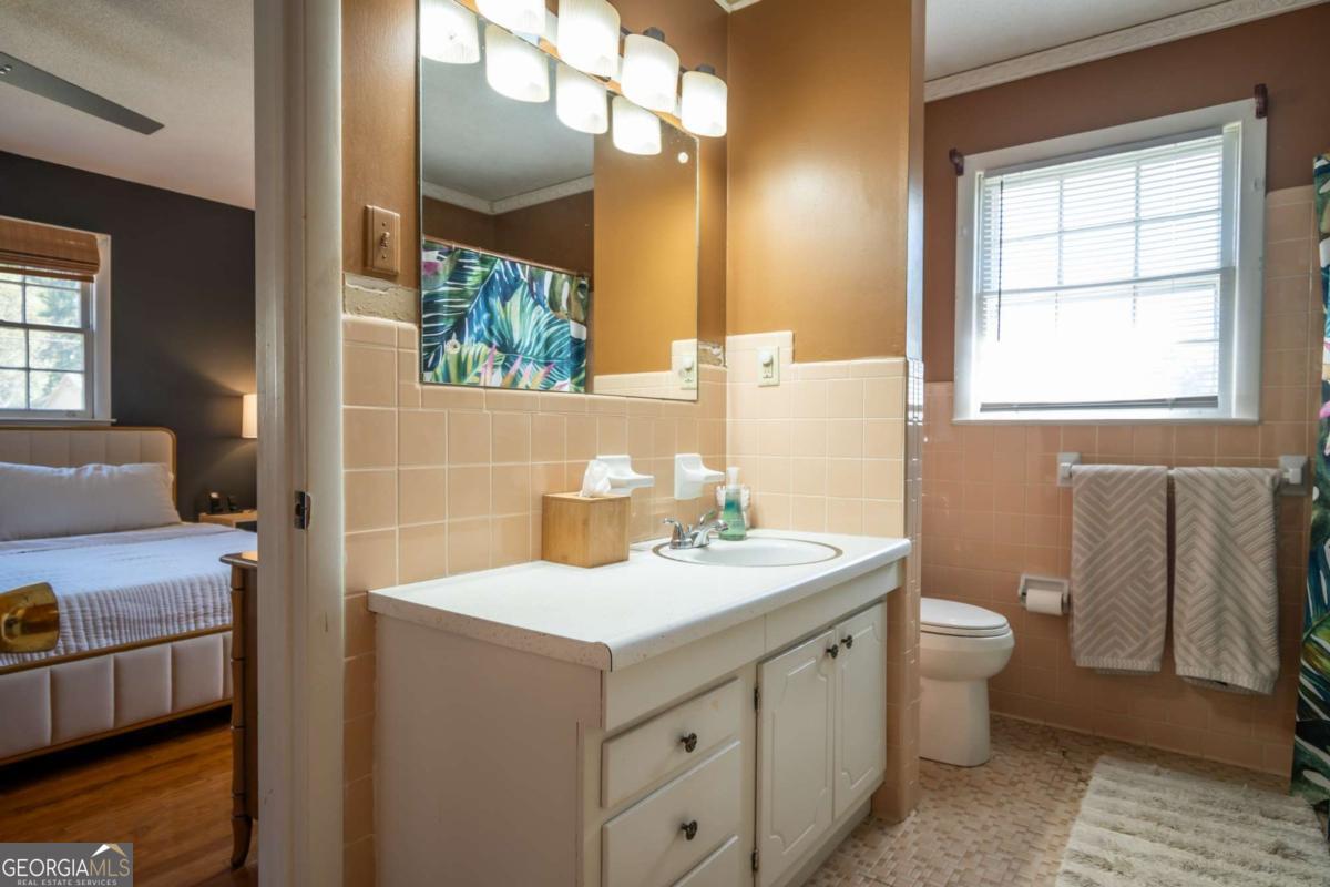 135 Tara Way Athens, GA 30606 - Photo 19 of 36 a bathroom with a sink and a mirror