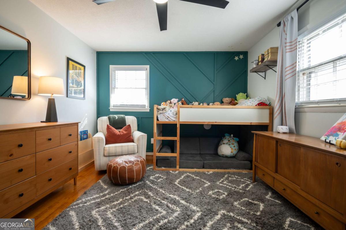 135 Tara Way Athens, GA 30606 - Photo 26 of 36 a bedroom with furniture and a fireplace