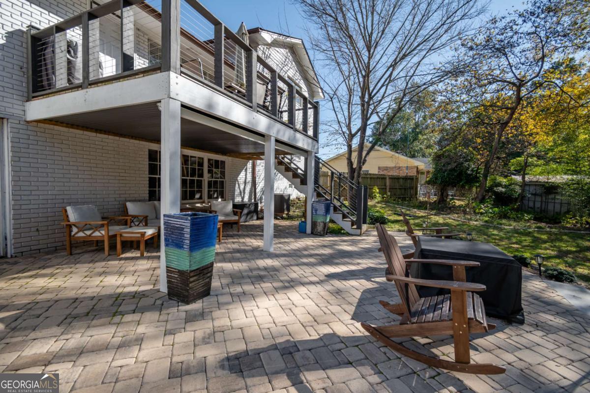 135 Tara Way Athens, GA 30606 - Photo 28 of 36 a view of a patio with table and chairs and potted plants