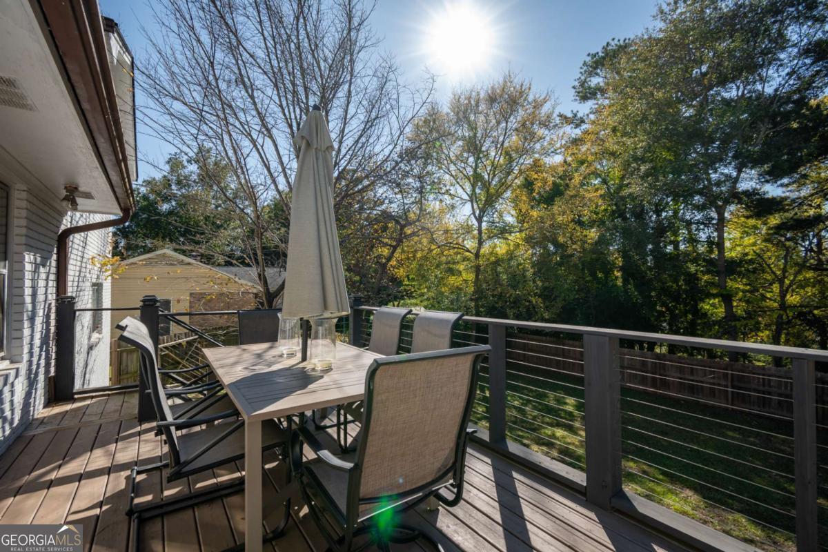 135 Tara Way Athens, GA 30606 - Photo 29 of 36 a view of a patio with a table chairs and a table
