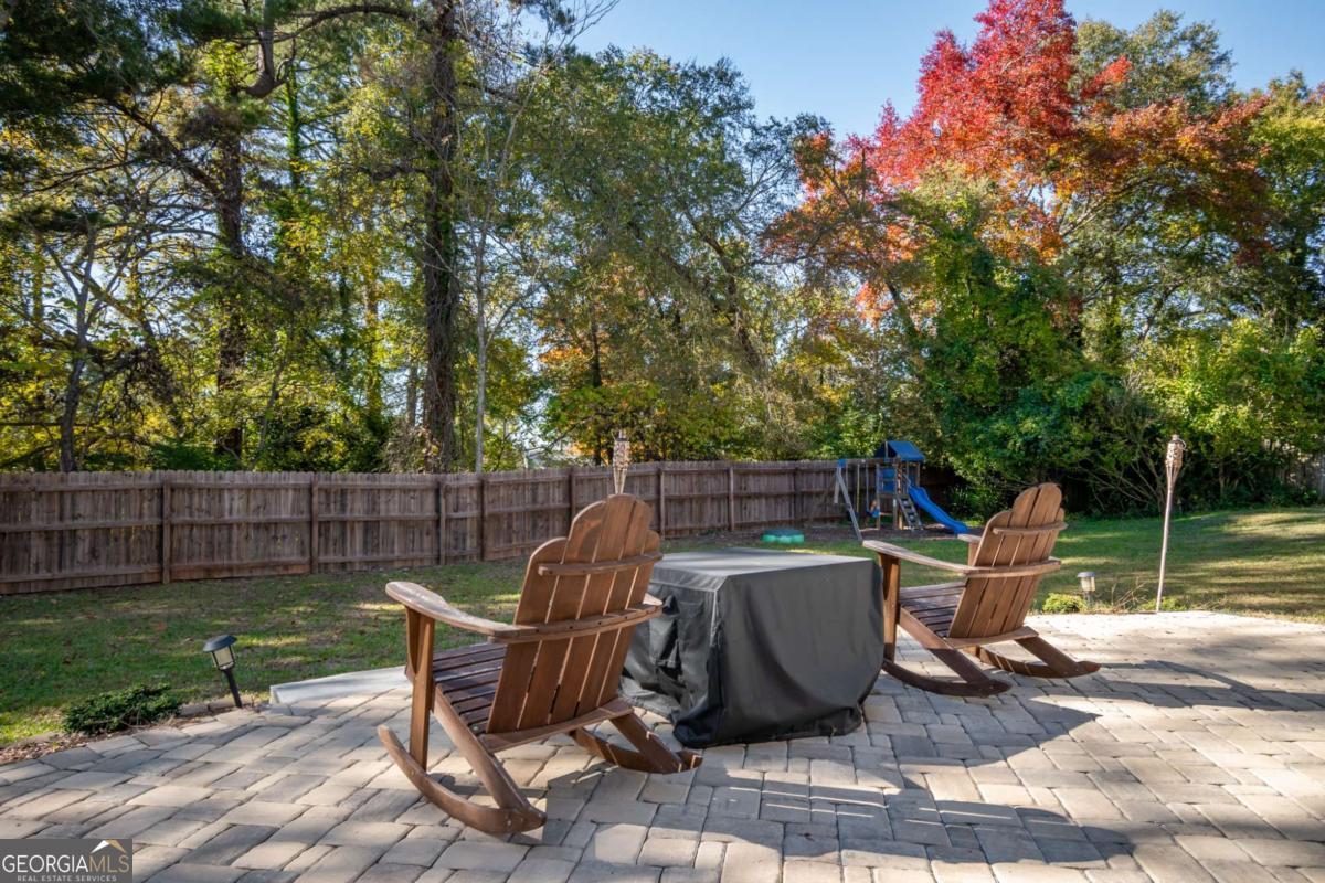 135 Tara Way Athens, GA 30606 - Photo 32 of 36 a view of a chairs and table in the back yard