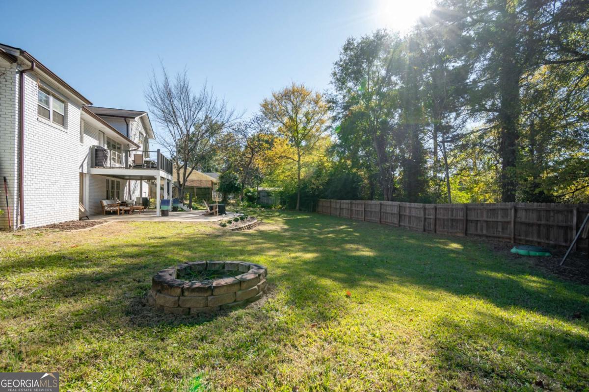 135 Tara Way Athens, GA 30606 - Photo 35 of 36 a view of a backyard with plants and large trees