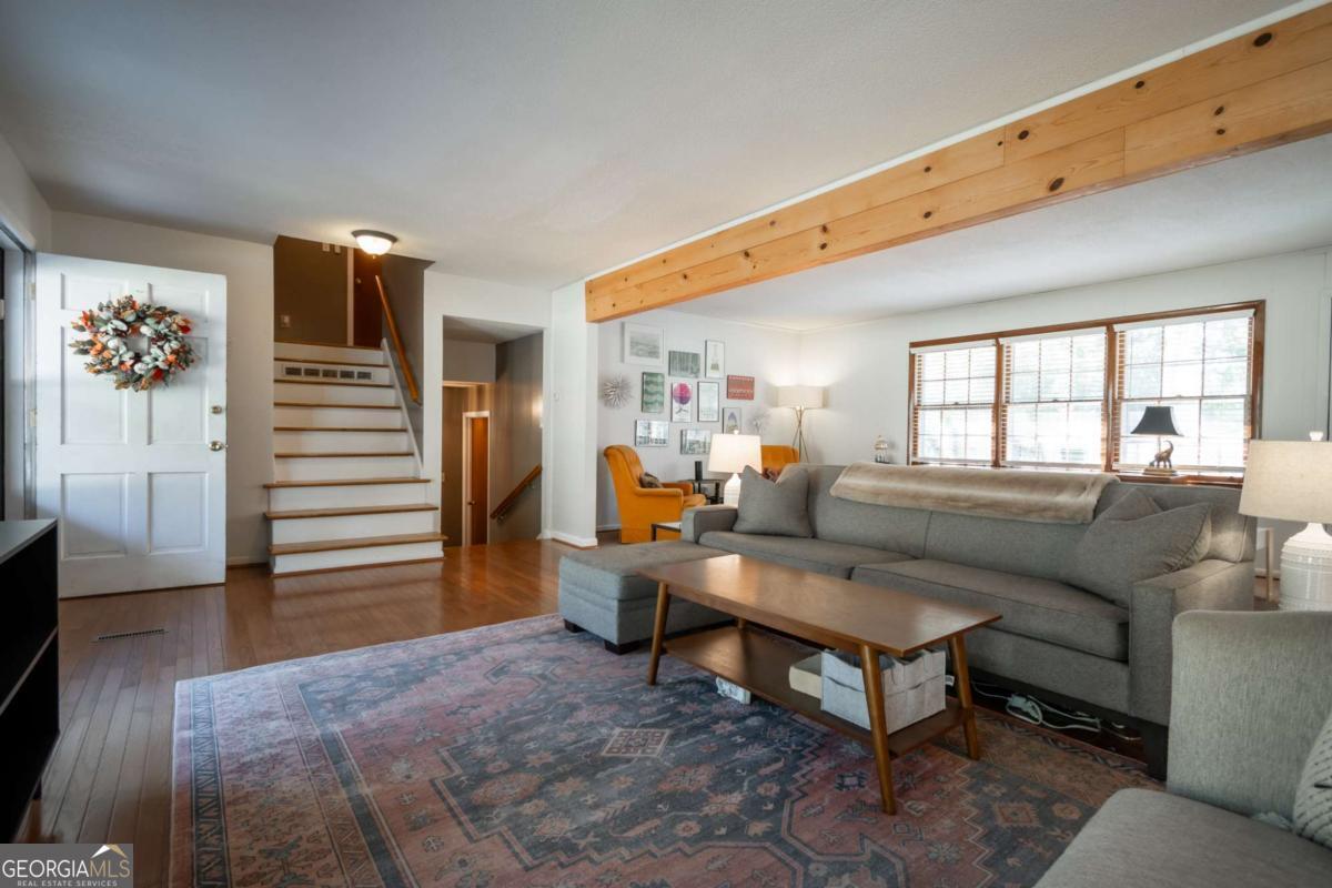 135 Tara Way Athens, GA 30606 - Photo 7 of 36 a living room with furniture and a window