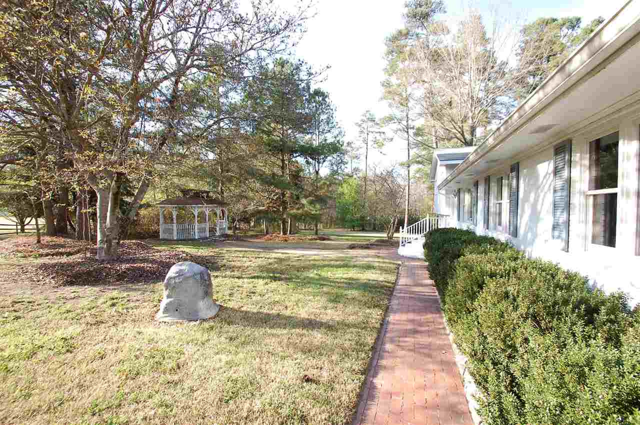 3004 Barnsley Lane Raleigh, NC 27604 - Photo 2 of 25 Brick walkways line the front yard, leading from the large driveway to the breezeway, front door, and gazebo. Exterior Front