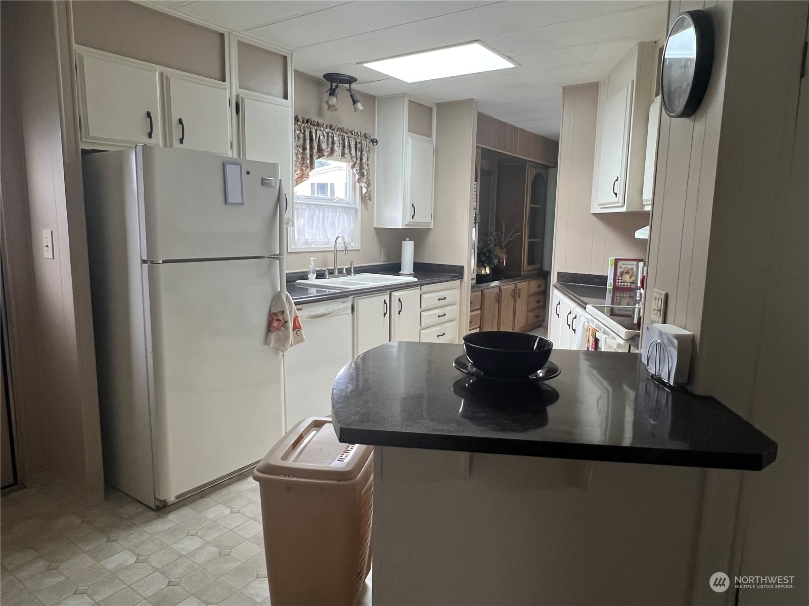 11622 Silver Lake Road, Unit 55 Everett, WA 98208 - Photo 14 of 17 a kitchen with stainless steel appliances granite countertop a refrigerator a stove and a sink