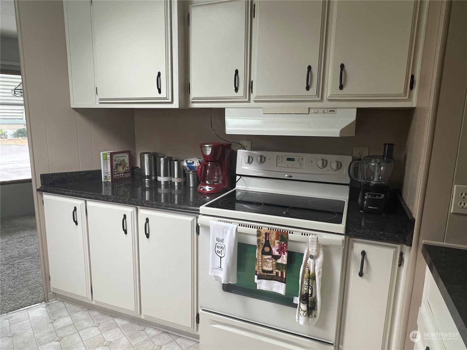 11622 Silver Lake Road, Unit 55 Everett, WA 98208 - Photo 15 of 17 a kitchen with white cabinets and sink