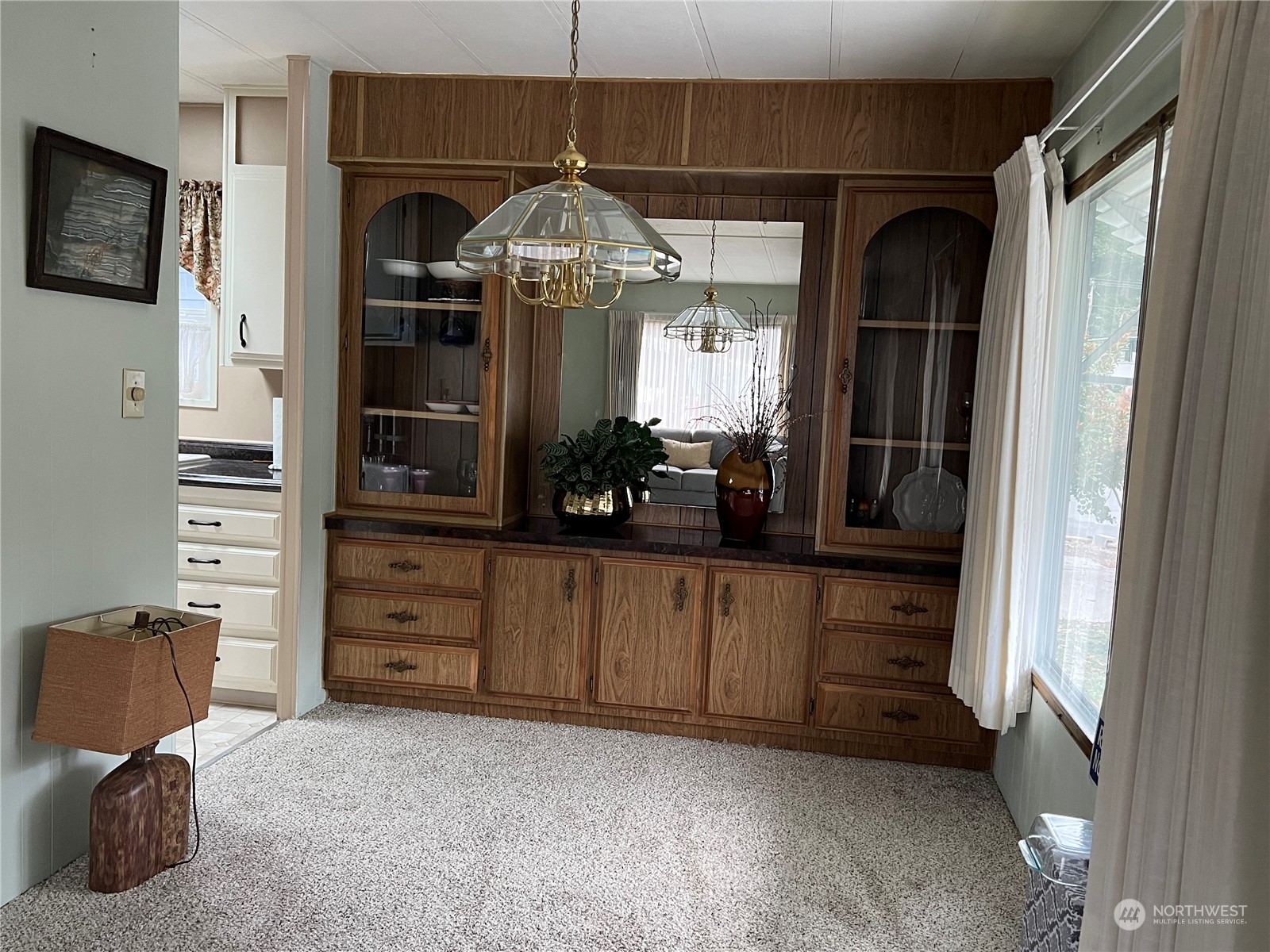 11622 Silver Lake Road, Unit 55 Everett, WA 98208 - Photo 8 of 17 a kitchen with a refrigerator and cabinets