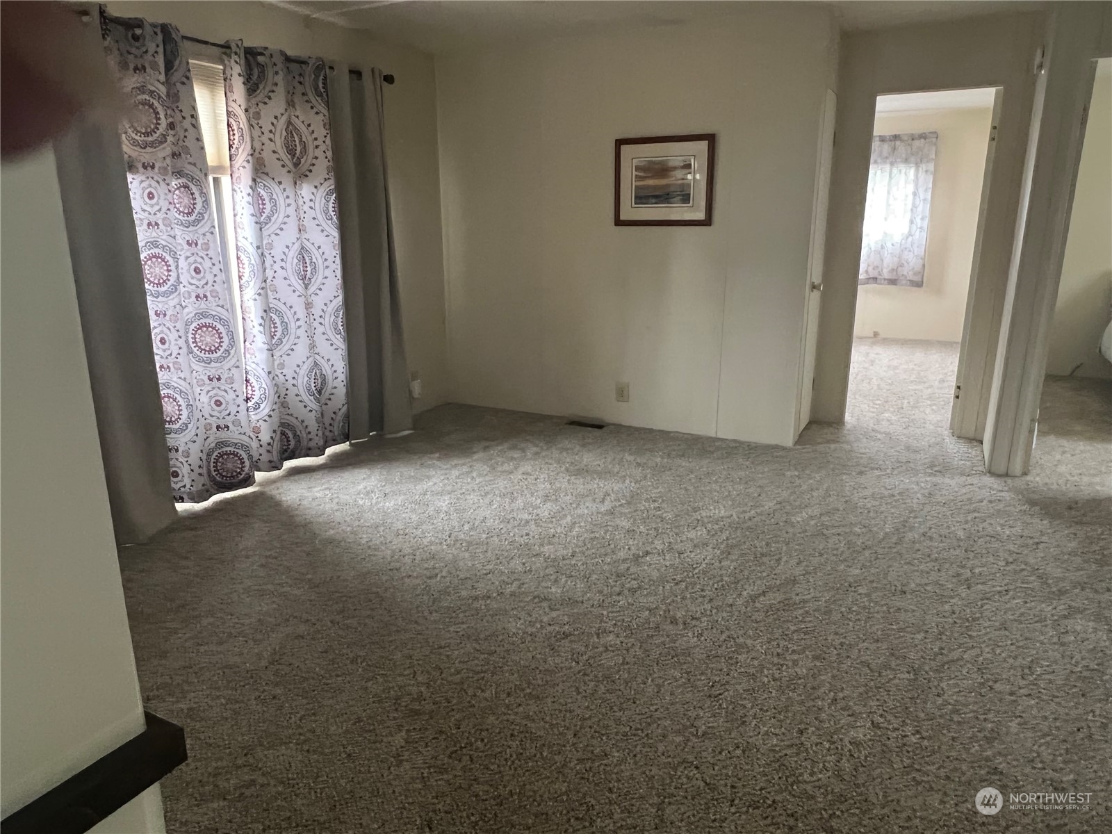 11622 Silver Lake Road, Unit 55 Everett, WA 98208 - Photo 9 of 17 a view of an empty room with a window