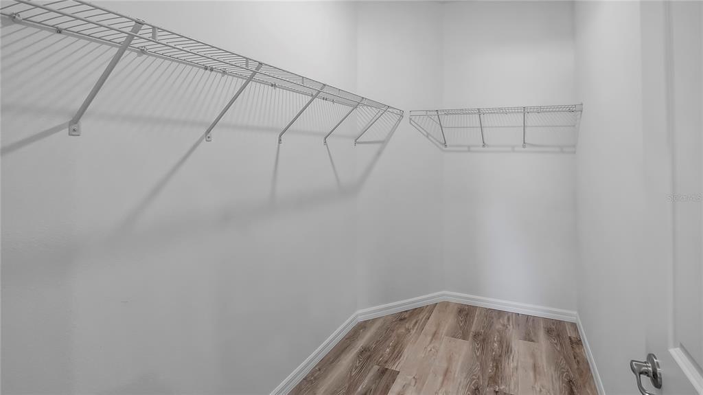 40407 West 8th Avenue Umatilla, FL 32784 - Photo 16 of 26 a view of a room with racks on the wall