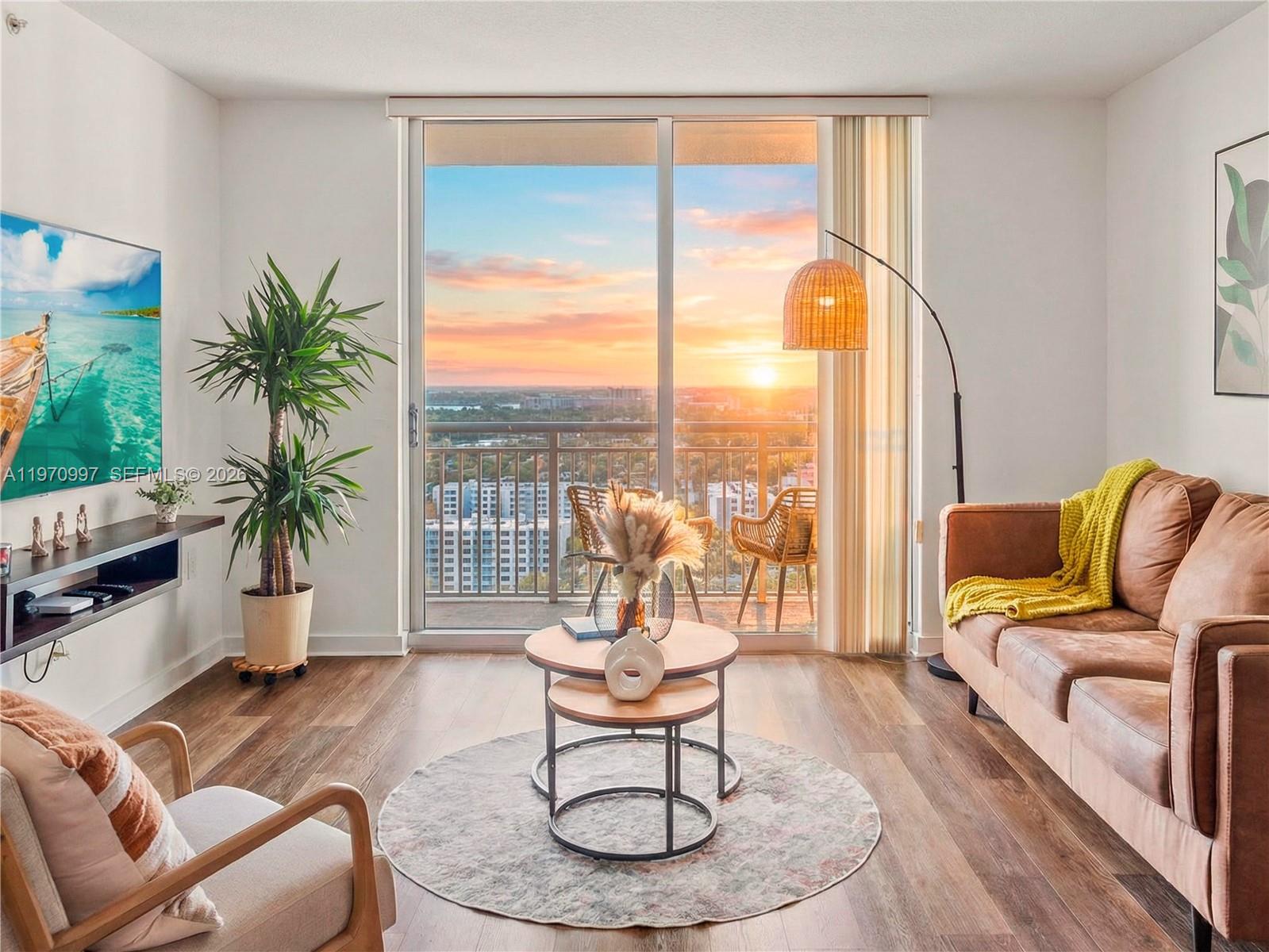 9066 Southwest 73rd Court, Unit 2008 Miami, FL 33156 - Photo 12 of 35 a living room with furniture and a large window