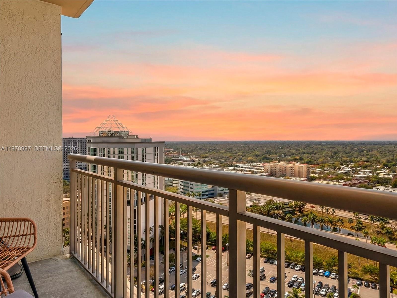 9066 Southwest 73rd Court, Unit 2008 Miami, FL 33156 - Photo 2 of 35 a view of city and mountain from a balcony
